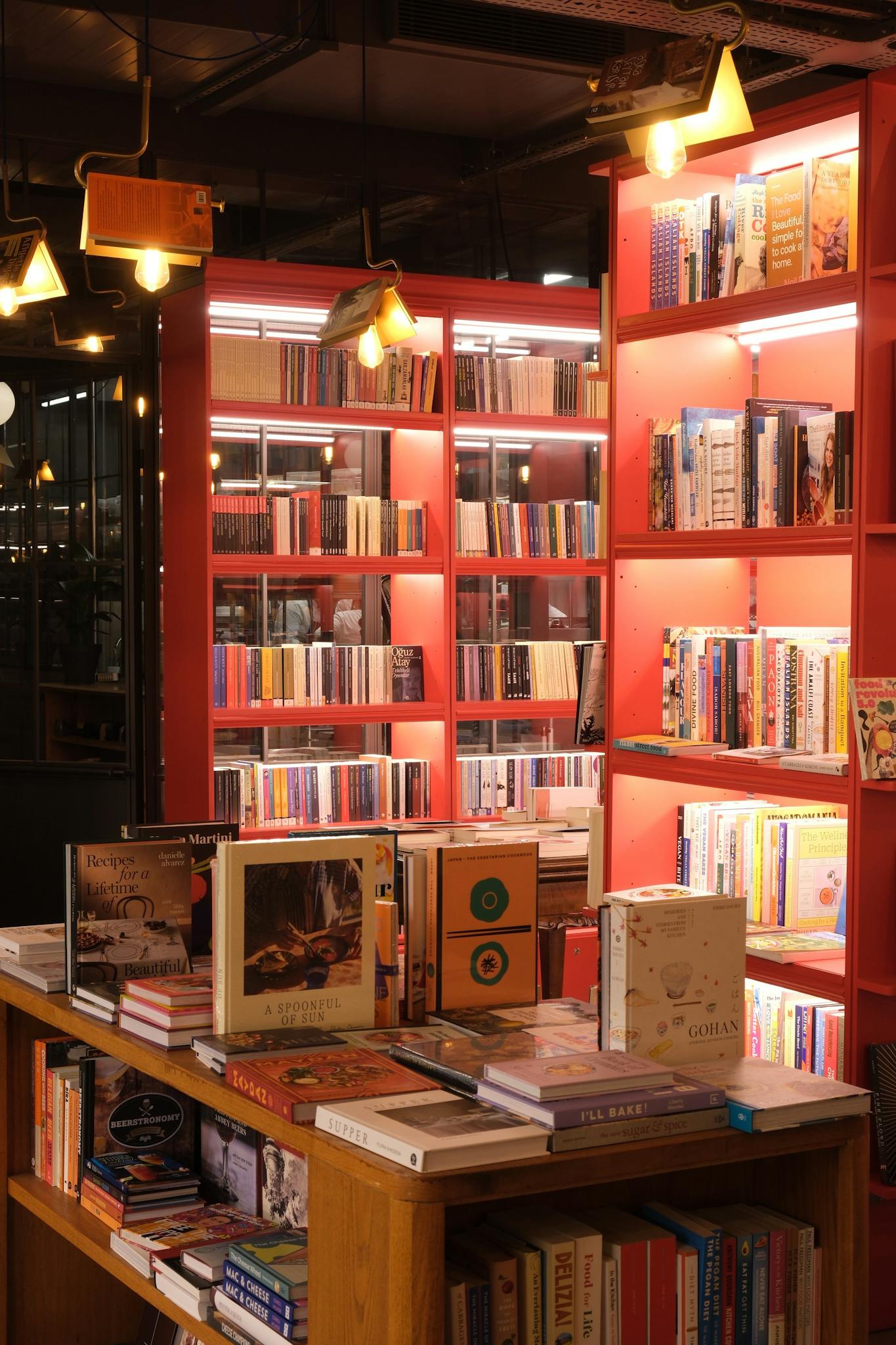 Warmly lit bookstore interior in Istanbul with vibrant shelves.